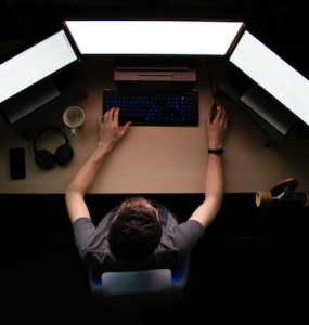 Person coding on PC