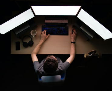 Person coding on PC