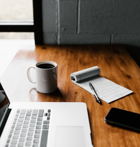 laptop developing with cup of coffe