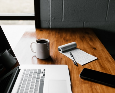 laptop developing with cup of coffe
