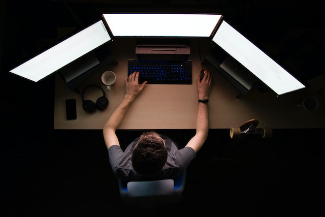 Person coding on PC