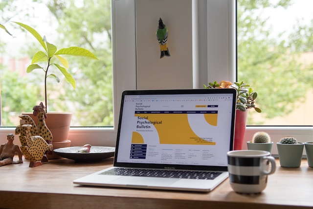 website on the laptop with a morning coffee