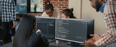 Team in Office Discussing Code