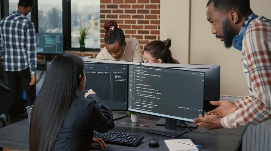 Team in Office Discussing Code